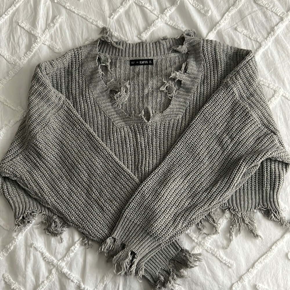 Distressed cropped sweater